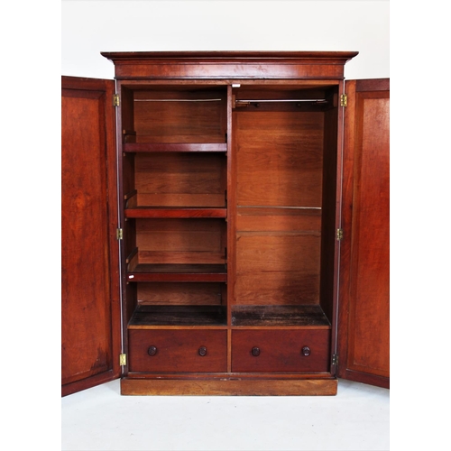 727 - A 19th century mahogany two door wardrobe, with a cavetto cornice above a pair of panelled doors enc... 