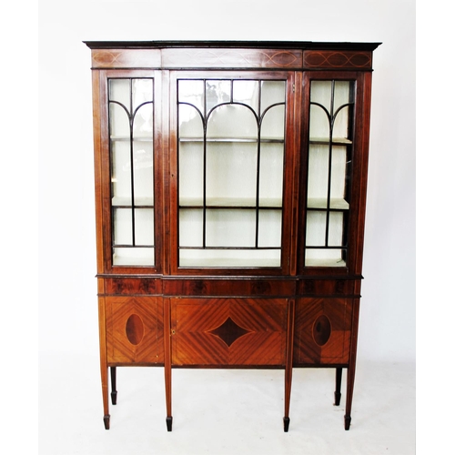 746 - An Edwardian mahogany breakfront display cabinet, the frieze inlaid with interlaced stringing, above... 