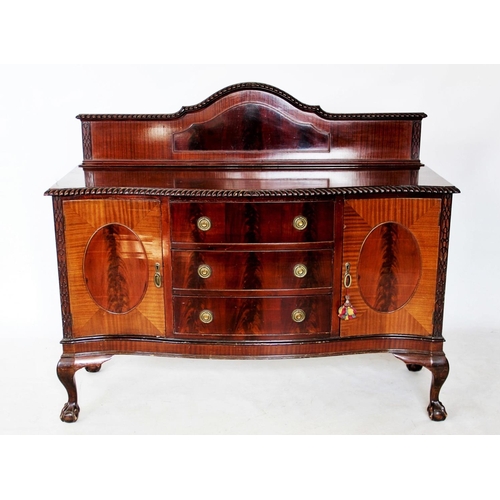 755 - A 1920's mahogany Chippendale revival dining room suite comprising; an oval extending table with a g... 