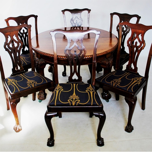 755 - A 1920's mahogany Chippendale revival dining room suite comprising; an oval extending table with a g... 