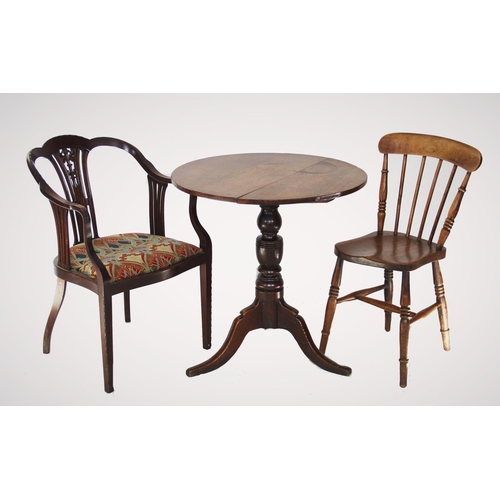 756 - An Edwardian mahogany elbow chair, with a pierced splat back, down swept arms enclosing the serpenti... 