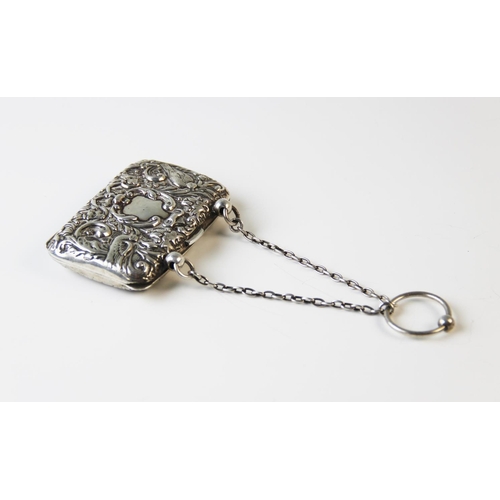 104 - An Edwardian silver lady's purse, Henry Matthews Birmingham 1904, embossed with masks and exotic bir... 