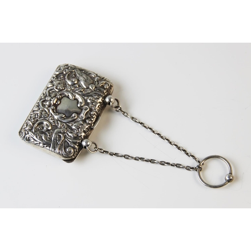 104 - An Edwardian silver lady's purse, Henry Matthews Birmingham 1904, embossed with masks and exotic bir... 