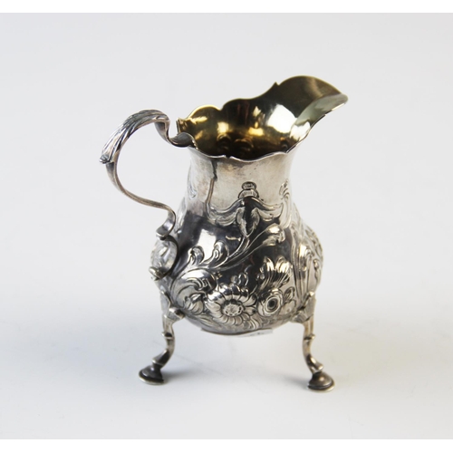 113 - A George III silver milk jug, Nathaniel Appleton & Ann Smith, London 1770, of typical form, on stepp... 