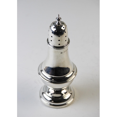 117 - A George V silver sugar caster, William Adams Birmingham 1914, in George I style, of plain polished ... 