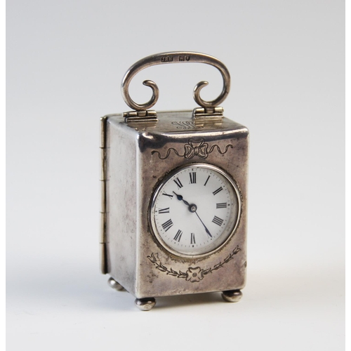 126 - An Edwardian silver cased bedside timepiece London 1906, 'EM' and 'JRH', the plain rectangular case ... 