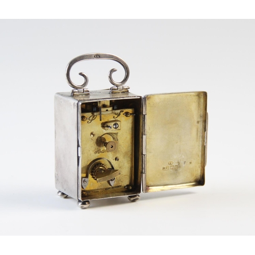 126 - An Edwardian silver cased bedside timepiece London 1906, 'EM' and 'JRH', the plain rectangular case ... 