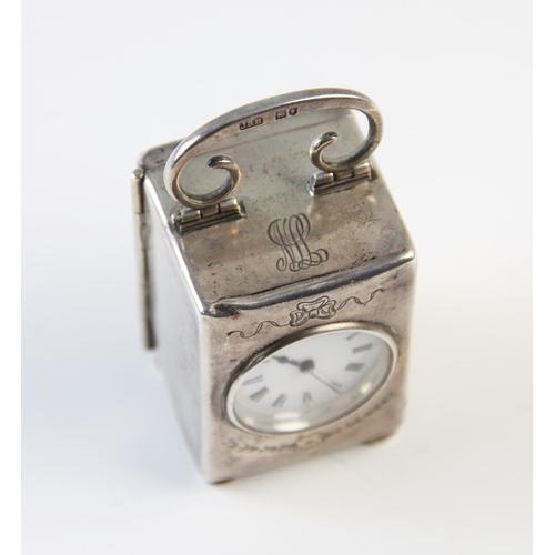 126 - An Edwardian silver cased bedside timepiece London 1906, 'EM' and 'JRH', the plain rectangular case ... 