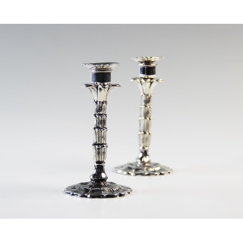 127 - A near pair of palm tree candle or taper sticks, one silver, one plate, both Hawksworth Eyre & Co, t... 