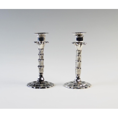 127 - A near pair of palm tree candle or taper sticks, one silver, one plate, both Hawksworth Eyre & Co, t... 