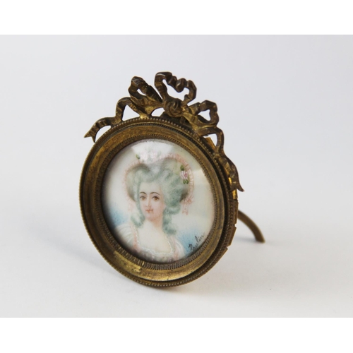 273 - After Jean-Baptiste Paulin Guerin, 
Portrait miniature of a lady wearing a rose trimmed bonnet, sign... 