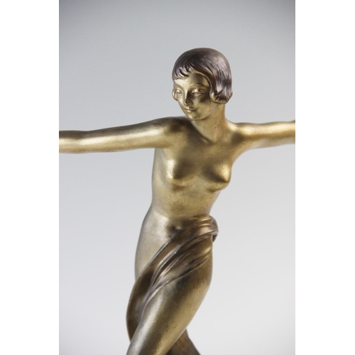 388 - An Art Deco spelter figure, early 20th century, the gilt patinated figure modelled as a girl dancing... 