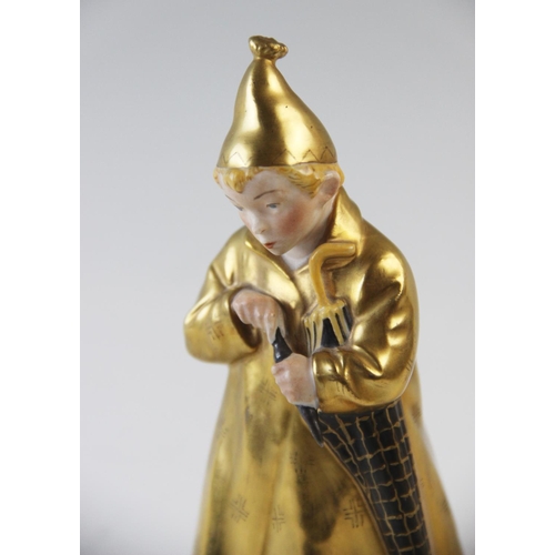 498 - A Royal Copenhagen figure 'The Sandman' model number 1145, with gilt coat and hat, 16cm high