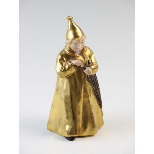 498 - A Royal Copenhagen figure 'The Sandman' model number 1145, with gilt coat and hat, 16cm high