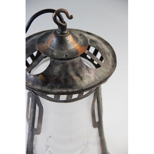 526 - An early 20th century Art Nouveau pendant light fitting, the copper oxidised frame tapering to accom... 