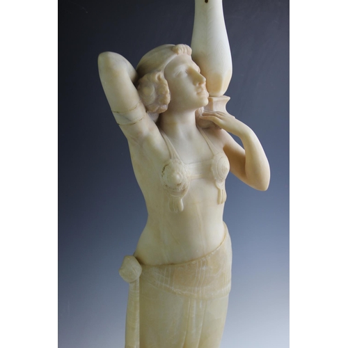 533 - An Art Deco alabaster figural lamp, modelled as an Egyptian revival dancing girl, arms raised, below... 