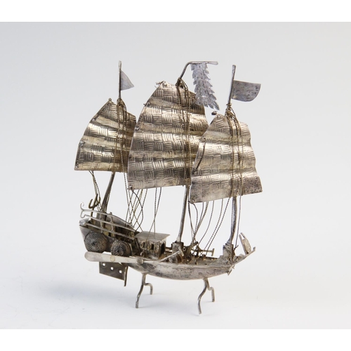 70 - A Chinese silver filligree junk, the three masted ship, upon integral stand, 66gms, 13cm high (at fa... 