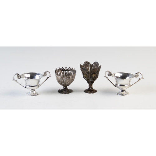 73 - Two filligree zarf type cups, 4.5cm and 6cm high, and two Italian silver two handled miniature troph... 