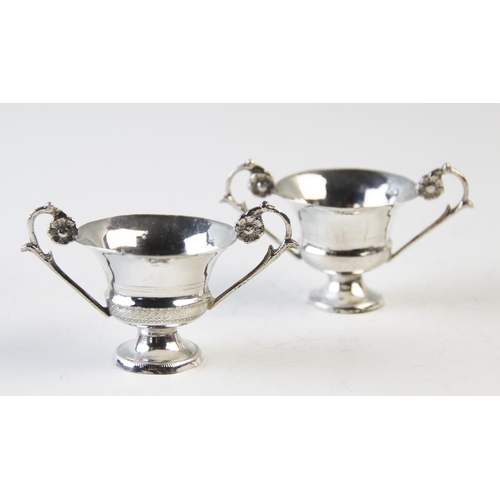 73 - Two filligree zarf type cups, 4.5cm and 6cm high, and two Italian silver two handled miniature troph... 