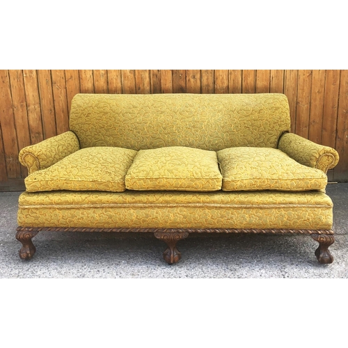 747 - An early 20th century three seater settee, covered in embossed foliate fabric, the three fitted seat... 