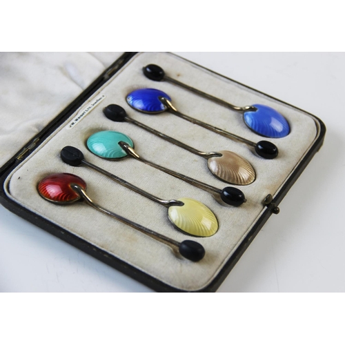 91 - A cased set of silver gilt and enamel coffee bean spoons, Henry Clifford Davis, Birmingham 1935, (at... 