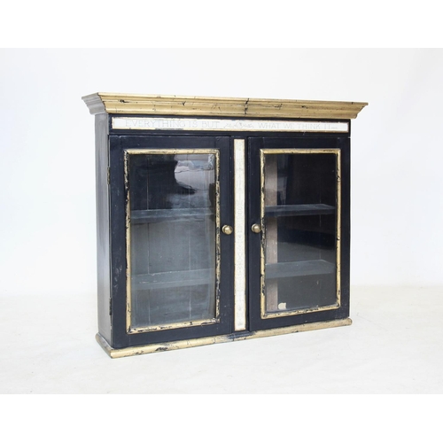 715 - A 19th century and later painted glazed wall cabinet, in a neoclassical style, painted in black with... 