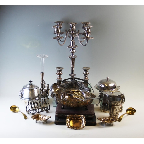 152 - A collection of silver plated wares and flatware, to include; a set of four salts, candlesticks, can... 