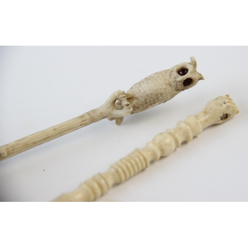 274 - A carved ivory dip pen, 19th century, carved as an owl perched upon a branch, 17.2cm long, a further... 