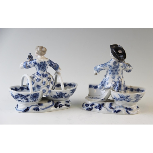 495 - A pair of late 19th century Meissen blue painted double salts depicting a boy and a girl in courtly ... 