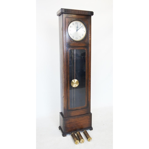 370 - An early 20th century oak cased longcase clock, the flat top with a reeded frieze above the 28cm sil... 