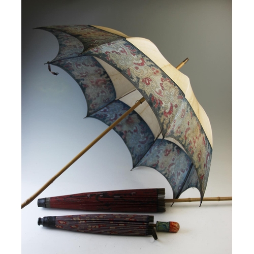 405 - A collection of 19th century and later riding crops, parasols and canes to include, four Japanese ex... 