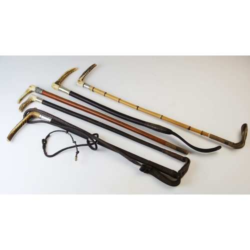 406 - Five assorted riding crops, to include, a bamboo example with horn handle and silver mount, a leathe... 