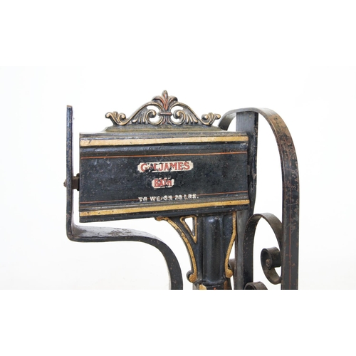 587 - A set of early 20th century Japanned cast iron grocers scales by G.M James, Bath, with a cast centra... 