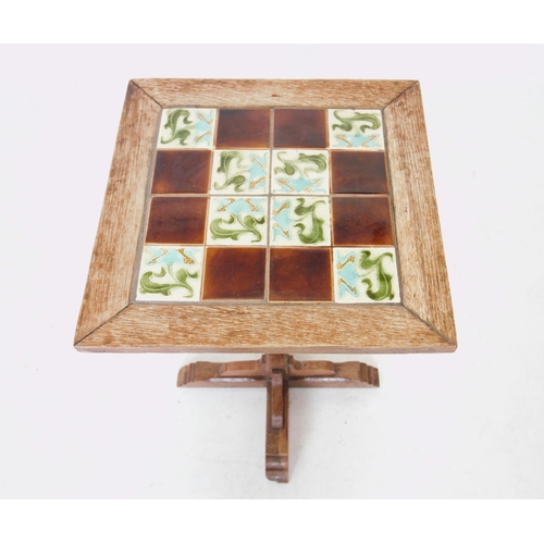 770 - An early 20th century tile top pedestal table, the square top inset with four Art Nouveau tiles, upo... 