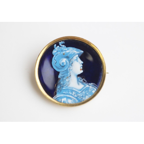 230 - An enamel on copper Limoges style brooch depicting a female classical warrior, of circular form and ... 