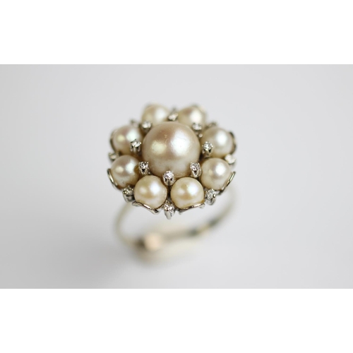 234 - An untested pearl and diamond cluster dress ring, 1960's, designed as a central pearl within diamond... 