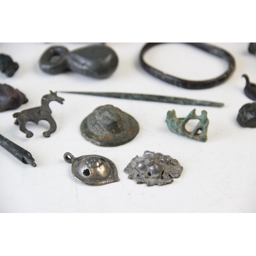 251 - A collection of Roman Empire and later artefacts, to include a Roman white metal pendant, 4cm long, ... 