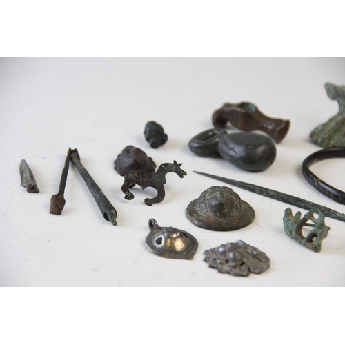 251 - A collection of Roman Empire and later artefacts, to include a Roman white metal pendant, 4cm long, ... 