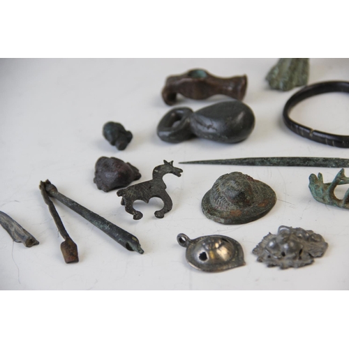 251 - A collection of Roman Empire and later artefacts, to include a Roman white metal pendant, 4cm long, ... 