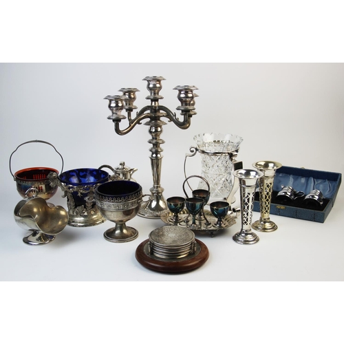 153 - A collection of silver plated wares, to include a silver plate mounted glass vase, posy vases, a can... 