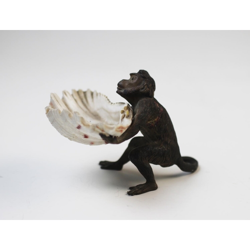 262 - Franz Bergman (Austrian, 1861-1936), A cold painted bronze model of a monkey holding a shell, by Ber... 