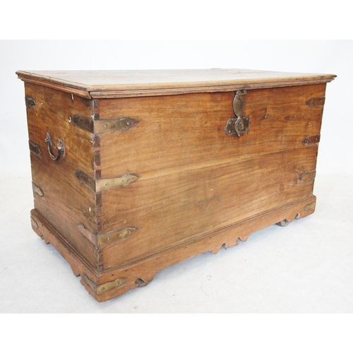 734 - A late 19th century Indian hardwood chest, the rectangular hinged top with shaped brass clasp lock e... 