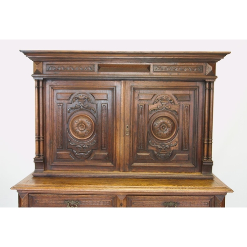 735 - A late 19th century French oak cupboard, with a moulded  and stepped cornice above a pair of cupboar... 