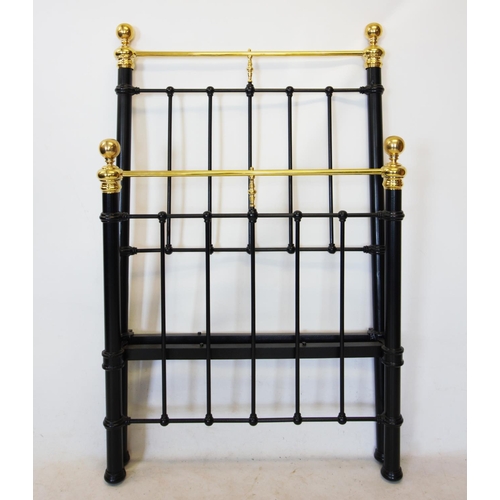 741 - A Victorian style single bed, with brass ball finials and top rail, above the black painted frame, w... 