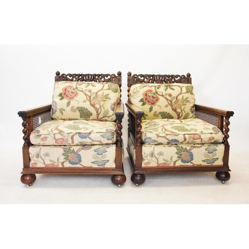 757 - An early 20th century walnut three piece bergere suite, comprising a three seater settee, with a car... 