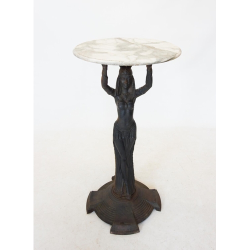 762 - An Art Deco cast iron figural bar table, the later white marble circular top raised upon an iron ped... 