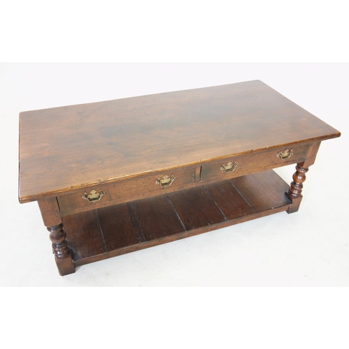 772 - A reproduction oak coffee table, 20th century, the rectangular top above two frieze drawers, raised ... 