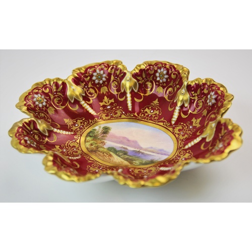 462 - A Coalport bonbon dish, late 19th/early 20th century, the shaped oval dish with central hand painted... 