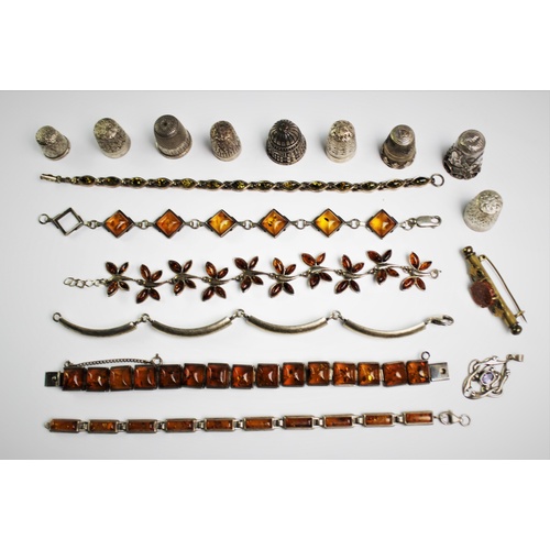 168 - A collection of white metal and amber set jewellery, to include, an Edwardian style white metal pend... 