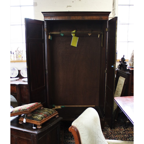 733 - A 19th century mahogany two door wardrobe, with a moulded cornice above a plain frieze and a pair of... 